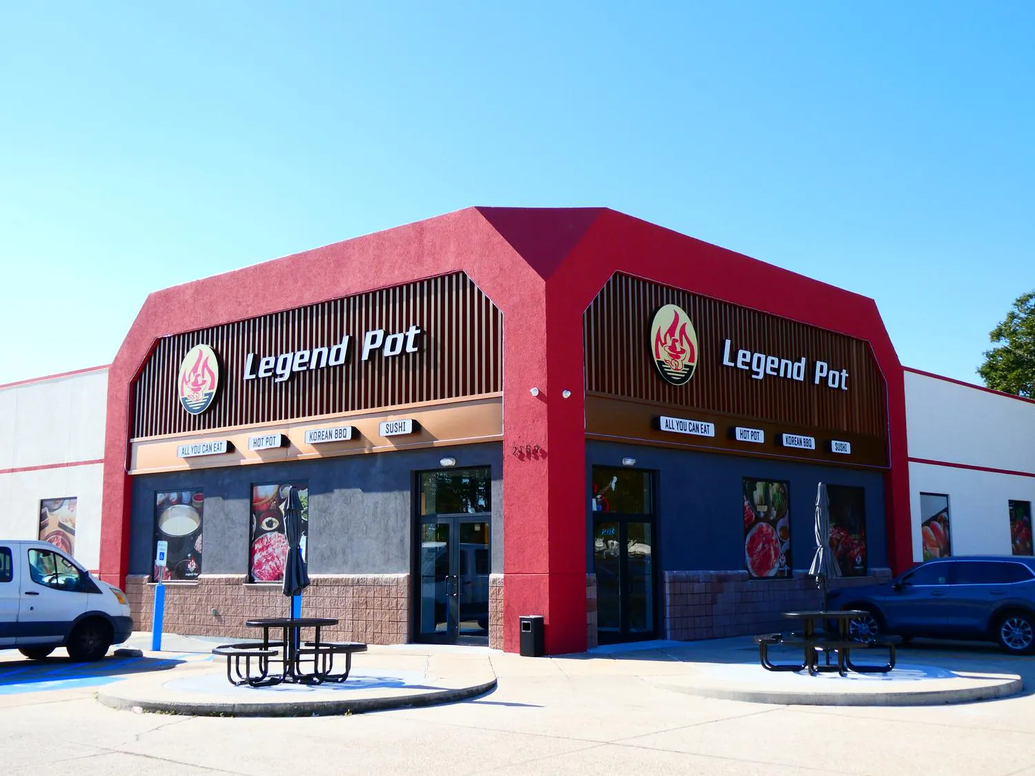 Legend-Pot-Hot-Pot-Restaurant-Baton-Rouge The exterior of the Legend Pot restaurant, a red building with large signage advertising "All You Can Eat" Hot Pot, Korean BBQ, and Sushi.